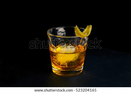 Cocktail RUSTY NAIL on black background