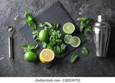 Cocktail Shaker And Ingredients For Mojito On Table