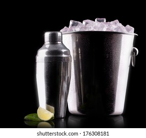 Cocktail Shaker With Metal Ice Bucket Isolated Against A Black Background