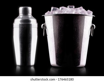 Cocktail Shaker With Metal Ice Bucket Isolated Against A Black Background