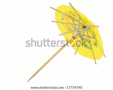 Cocktail umbrella against a white background