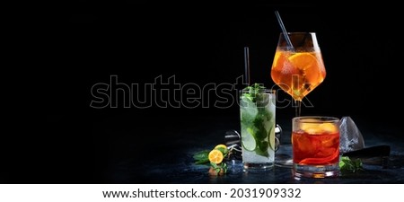 Cocktails assortment served on dark background. Classic drink menu concept. Copy space, panorama