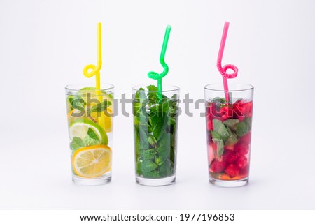 Similar – Infused water in bottles with drink straw and ingredients on white background, front view. Water Flavored with fruits, berries and herbs. Summer drinks. Healthy and clean detox beverages.