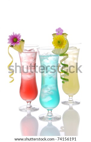 Cocktails margarita martini row with vodka, light rum, gin, tequila, blue curacao, lime juice, lemonade, lemon slice and fresh summer flowers in martinis cocktail glass on a white background