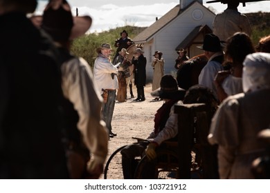 Cocky Gunfighter Waves Back Crowd In An Old West Showdown