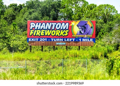 Cocoa Beach, USA - July 8, 2021: Interstate Highway Road 95 In Florida With Roadside Advertisement Billboard For Phantom Fireworks Store Exit Sign