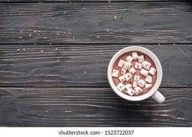 Cocoa Chocolate Cup With Hot Drink And White Marshmallow On Wood Desk Cozy Background, Cacao In Mug On Brown Wooden Rustic Table, Holiday Coffee House Shop, Above Top Overhead View, Copy Space