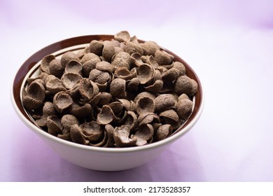 Cocoa Crunch Cereal Isolated On Violet Background