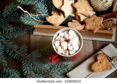 Cocoa with marshmallows and gingerbread on wooden background - Powered by Shutterstock