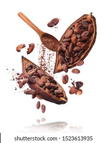 Cocoa pod flying in the air. Cracked cocoa pod and beans and wooden spoon with cocoa powder levitate on white background. High resolution image. Levitation concept.