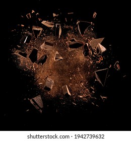 Cocoa powder with chocolate pieces and curls explosion on black backgrounds - Shutterstock ID 1942739632