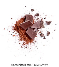 Cocoa Powder And Pieces Of Dark Chocolate, Isolated On White Background. Cake Ingredients, Top View Or High Angle Shot.