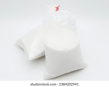 Coconat milk or santan cair in plastic