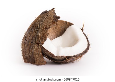  A coconut broken into pieces, coconut milk, coconut pulp, walnut. isolated on white background with clipped path.