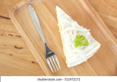 Coconut Cake On Wooden Table From Top View Shot With Selective Focus On The Coconut