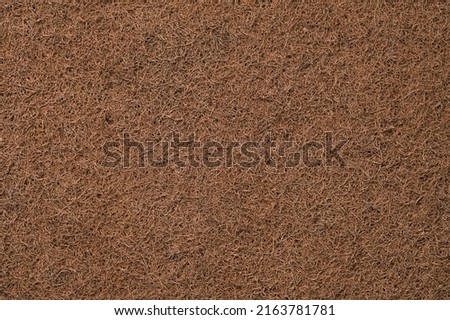 Coconut coir, natural background. Top view of coco fiber mattress, natural material, consumption ecology and care for health and environment.