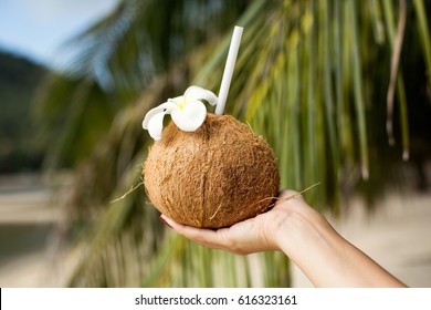 Coconut drink in hand