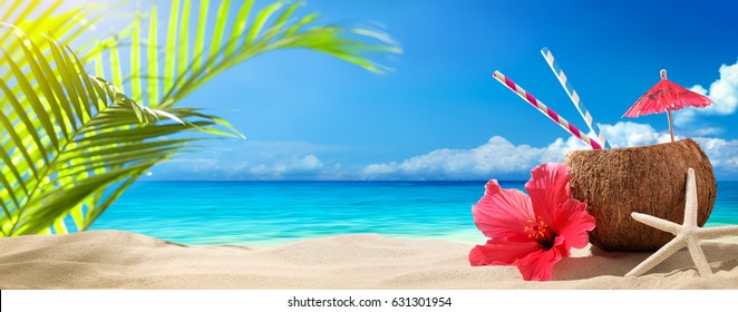 Coconut drink on sand beach,summer vacation on beach.