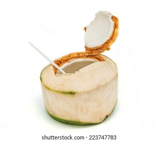 Coconut with drinking straw on white background.