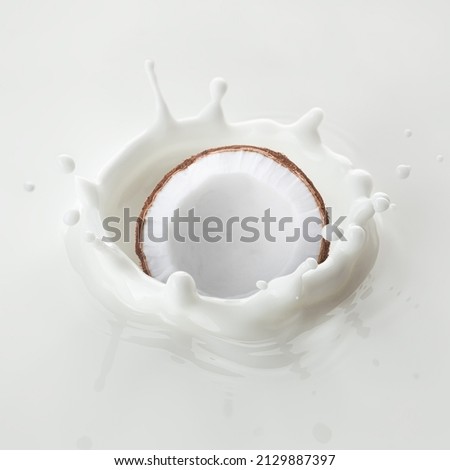 Coconut falls into milk, yoghurt, sour cream, Splash