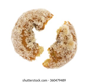 A Coconut Flaked Plain Donut Broken In Half Isolated On A White Background.