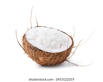 Coconut flakes in nut shell isolated on white