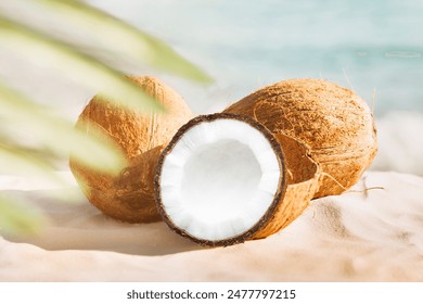 Coconut fruit with cut in half and leaves isolated on white background. - Powered by Shutterstock