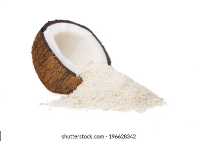 A Coconut Half And A Pile Of Shredded Coconut Isolated On A White Background