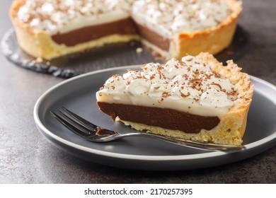 Coconut Haupia And Chocolate Pie Topped With Whipped Cream Closeup In The Plate On The Table. Horizontal
