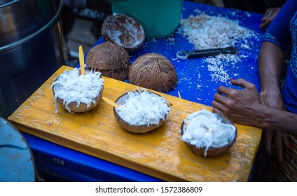 Coconut ice cream served in a coconut shell on a street market stall