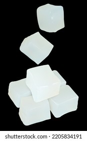 Coconut jelly cubes isolated on black background - Shutterstock ID 2205834191