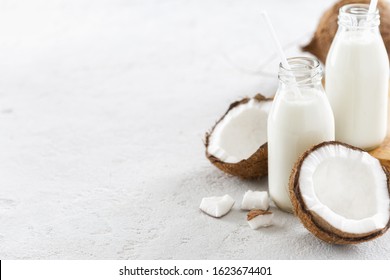 Coconut Kefir In Bottles On Light Background. Vegan Non Dairy Healthy Or Fermented Drink. Healthy Eating Concept