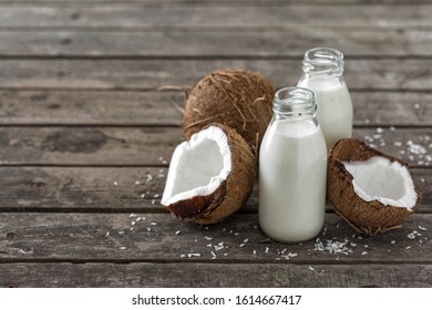 Coconut Kefir In Bottles On Wooden Table. Vegan Non Dairy Healthy Or Fermented Drink. Healthy Eating Concept