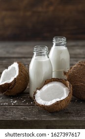 Coconut Kefir In Bottles On Wooden Table. Vegan Non Dairy Healthy Or Fermented Drink. Healthy Eating Concept