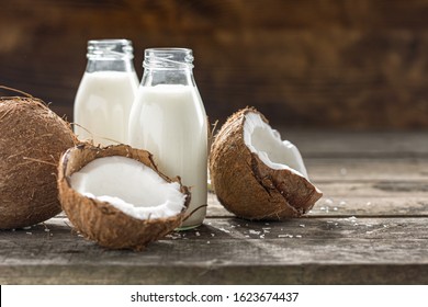 Coconut Kefir In Glass Bottle On Wooden Table. Vegan Non Dairy Healthy Or Fermented Drink. Healthy Eating Concept