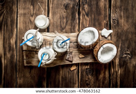 Similar – Image, Stock Photo Coconut oil in wooden bowl with spoon and moisturizing cream