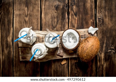 Image, Stock Photo Coconut oil in wooden bowl with spoon and moisturizing cream