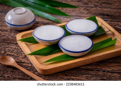 Coconut milk custard in small porcelain cup (Kanom Tuay), Thai dessert - Shutterstock ID 2238483611
