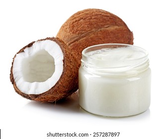 coconut oil and fresh coconuts isolated on white - Shutterstock ID 257287897