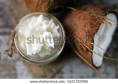 Similar – Image, Stock Photo Coconut oil in wooden bowl with spoon and moisturizing cream