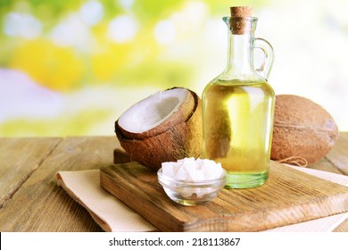 Coconut oil on table on light background - Shutterstock ID 218113867