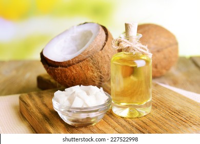 Coconut oil on table on light background - Shutterstock ID 227522998