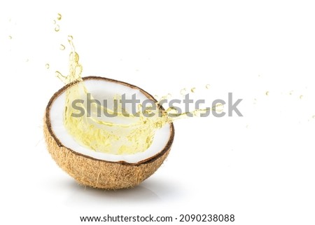 Coconut oil splash from coco nut fruit isolated on white background.