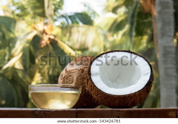 coconut and\
coconut oil with coconut tree\
background