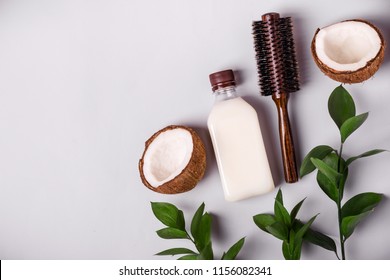 Coconut oil and tropical leaves. Hair care spa concept.