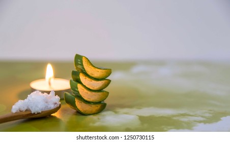 
Coconut Oil In Wooden Spoon And Aloe Vera On Colored Background . 
Healthy Lifestyle And Natural Skin Care