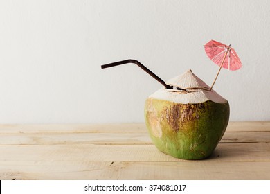coconut on wooden floor with white background