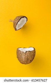 Coconut On Yellow Colored Background, Minimal Flat Lay Style