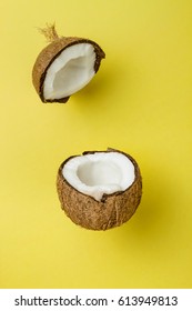 Coconut On Yellow Colored Background, Minimal Flat Lay Style