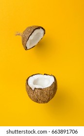 Coconut On Yellow Colored Background, Minimal Flat Lay Style